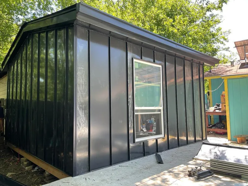 Black standing seam metal wall panels for Roof Inspection in Holly